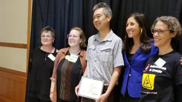 Dr. Nathan Phillips, receiving Dick Clapp award along with Alice Arena, Claire B.W. Müller, Sylvia Broude, and Dr. Madeleine Scammell.